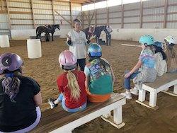 Mary with kids and horses